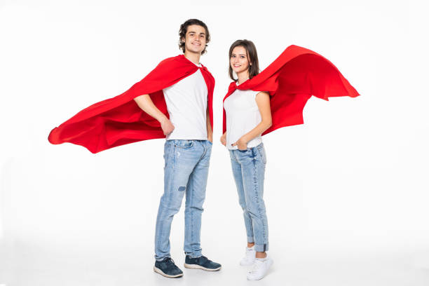 istock Young superhero couple isolated on white background 1212941260