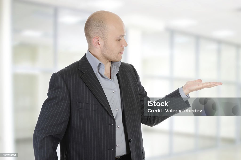 businessman holds his hand palm up.  25-29 Years Stock Photo