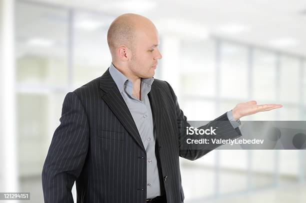 Businessman Holds His Hand Palm Up Stock Photo - Download Image Now - 25-29 Years, 30-39 Years, Adult