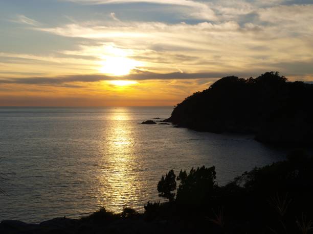 istock Izu coastline and sea at sunset 1212942066