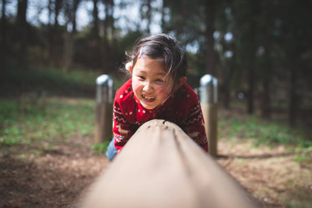 istock Girl playing in the park 1212945320