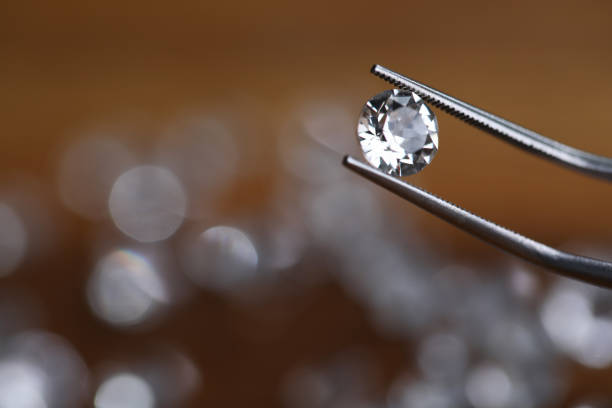 Painstaking jewelry work, looking at diamond.