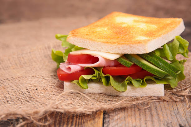 istock sandwich with avocado, tomato, cheese, ham and lettuce 1212945767