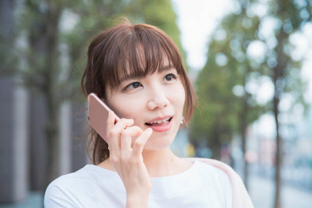 istock A woman talking on a smartphone 1212947376