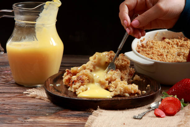 istock Traditional British Apple Crumble with Custard 1212947418