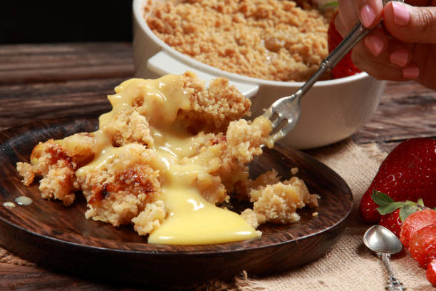 istock Traditional British Apple Crumble with Custard 1212947448