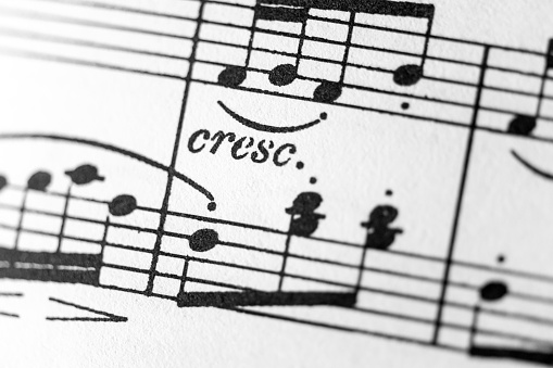 Musical score sheet music close up: Crescendo