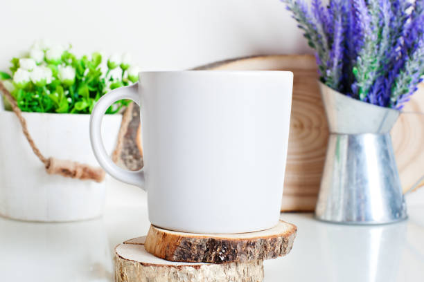 istock White mug on a background of flowers . Mock up. Template Space for creative artwork. Lettering text product promotion branding. 1212947860