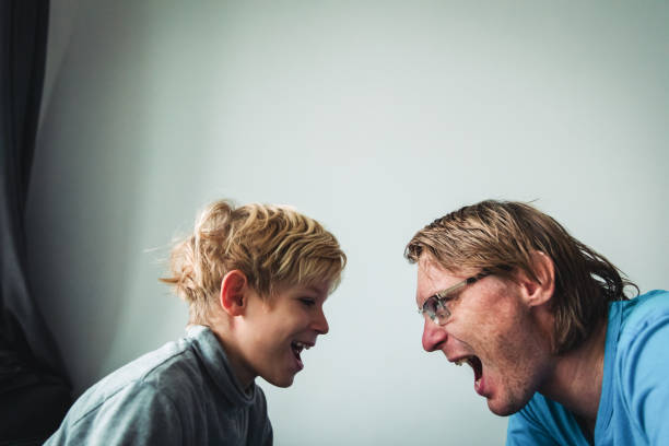 istock father and son conflict, agression, abuse, misunderstanding 1212948627
