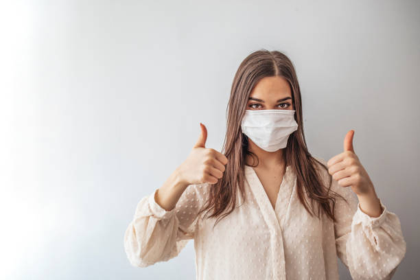 istock Woman suffer from sick and wearing face mask 1212948869