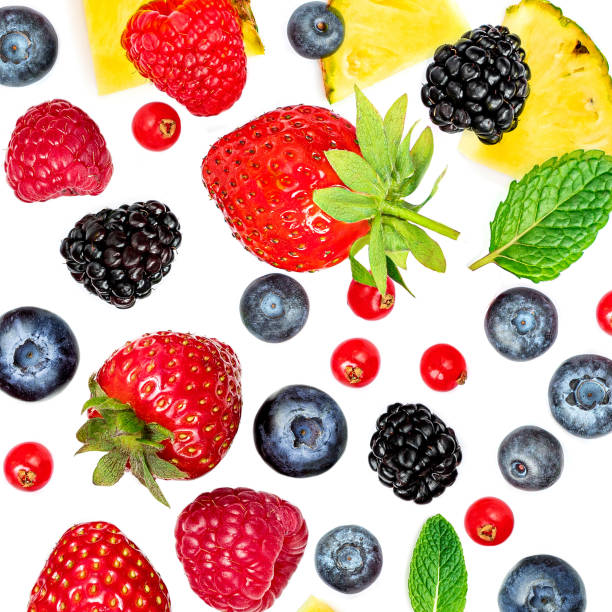 istock Summer Pattern with  fresh fruits and mix berries isolated on white background. Strawberry, Pineapple, blackberry, blueberry, cranberry. Flat lay. Food concept.