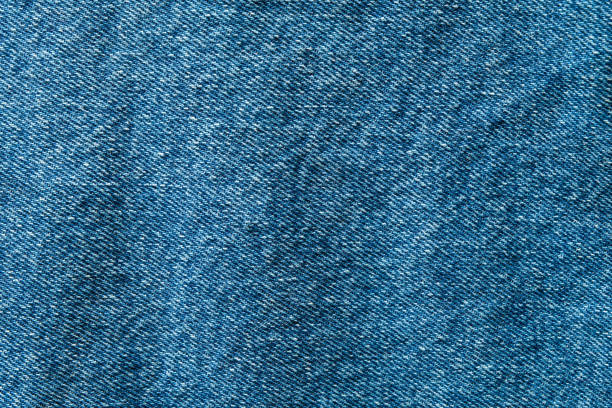 selektive fokus blaue jeans-denim-top-ansicht nah aufnahme bis zum detail des gewebes. textilmaterial und baumwolle patter zäh und langlebig kleidung stil. für hintergrund oder hintergrundbild mit kopierraum für text - fashion rough jacket garment stock-fotos und bilder