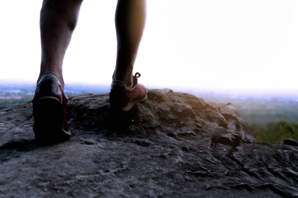 istock Man legs hiking on mountain for adventure 1212951834