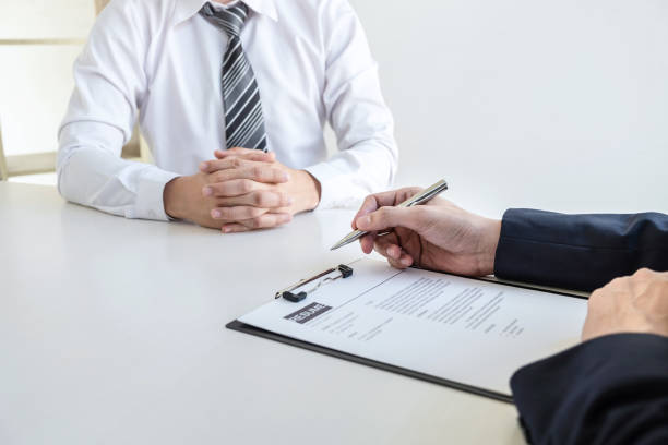 istock Businessman interview consider a resume conversation during about profile of candidate of conducting a job interview listen to answers while sitting at the working meeting in office 1212952426