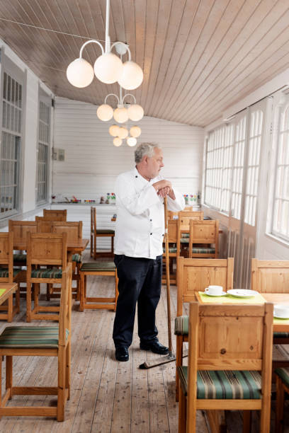 istock Restaurant owner closing his restaurant. 1212952526