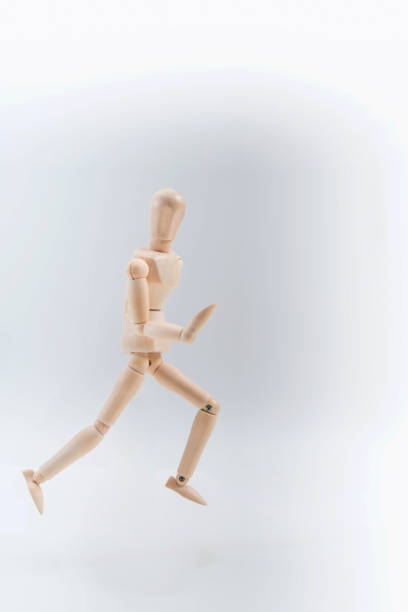 istock Wooden dummy proudly presents some invisible thing, isolated on white background, copy space for your object or text 1212954369