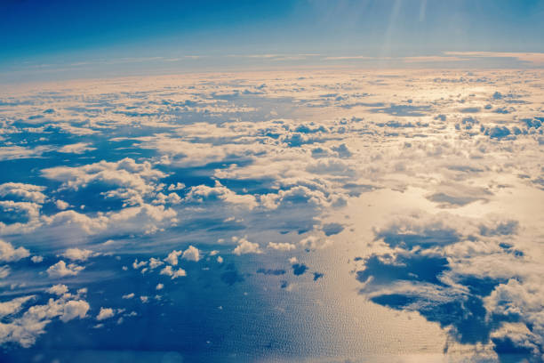 istock sunny blue cloudy sky and water 1212959537