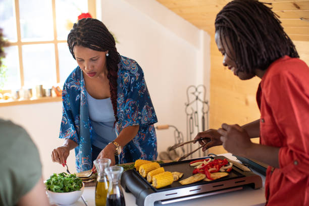 istock Two women preparing meal without meat 1212960400