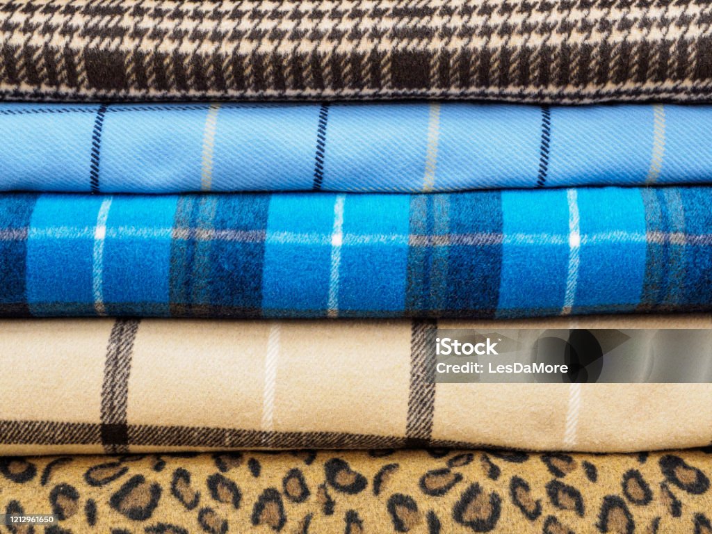 Rolls Of Different Checkered Fabrics For Sewing Coats Closeup Samples Of  Different Checkered Fabrics Are On The Shelves In The Fabric Store  Beautiful And Fashionable Fabrics For Ateliers Stock Photo - Download