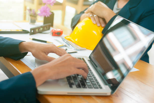 istock Businessmen and engineers consult and plan the design of construction projects. 1212963940