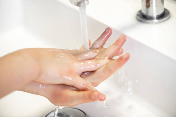 istock Child washing hands close up 1212964396