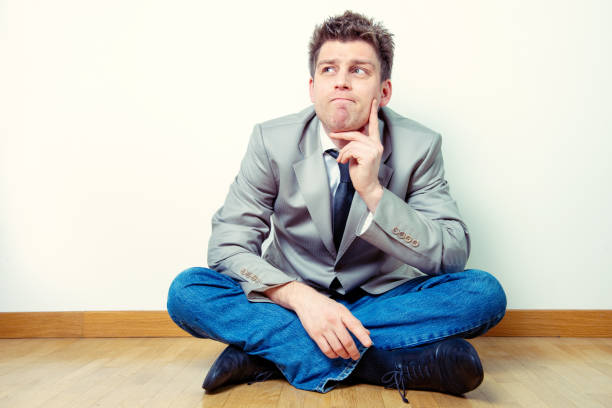 istock Portrait of a man sitting in interrogative expression. Business concept, idea 1212964618