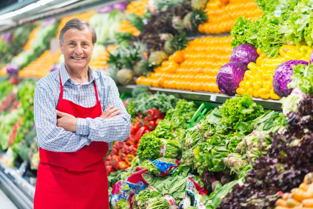 istock Senior man working in a supermarket 1212966215