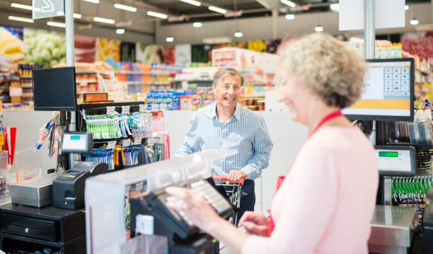 istock Argentinian senior man checking out at supermarket 1212966686