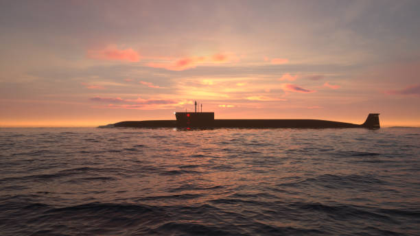 istock Submarine in ocean at sunset 1212966846