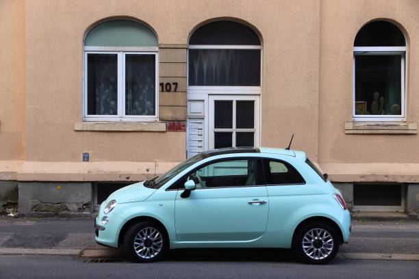 Fiat 500 in Germany Fiat 500 small city hatchback car in Germany. There were 45.8 million cars registered in Germany (as of 2017). little fiat car stock pictures, royalty-free photos & images