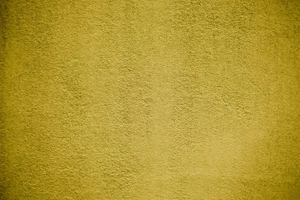 Canary-yellow background wall old paint background texture of plaster and cement. Mustard background wall