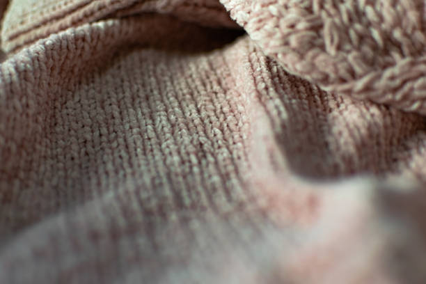 istock Fine textured and voluminous fabric in pink. Embossed textile pattern, pleasant to the touch and delicate 1212973160