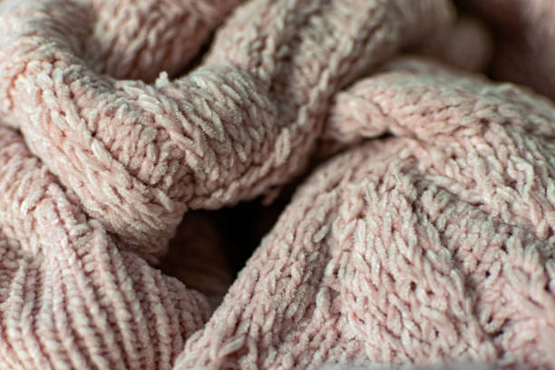 istock Fine textured and voluminous fabric in pink. Embossed textile pattern, pleasant to the touch and delicate 1212973163