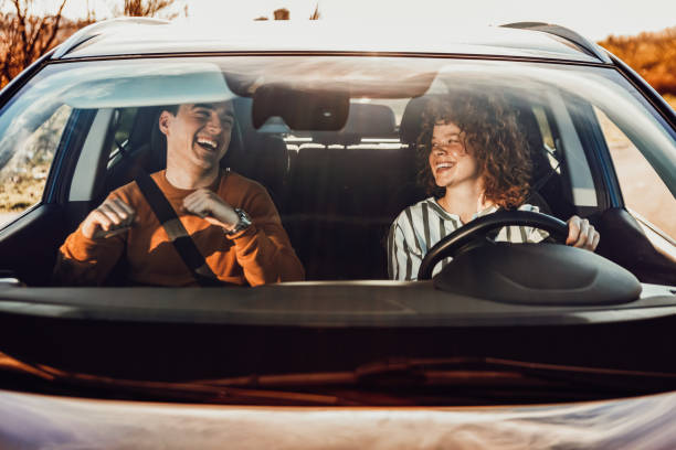 istock Happy young couple enjoying in drive 1212974101