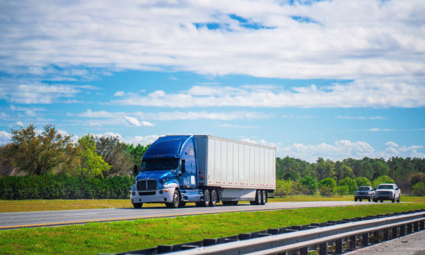 istock Blue and white semi truck Florida highway 1212976724