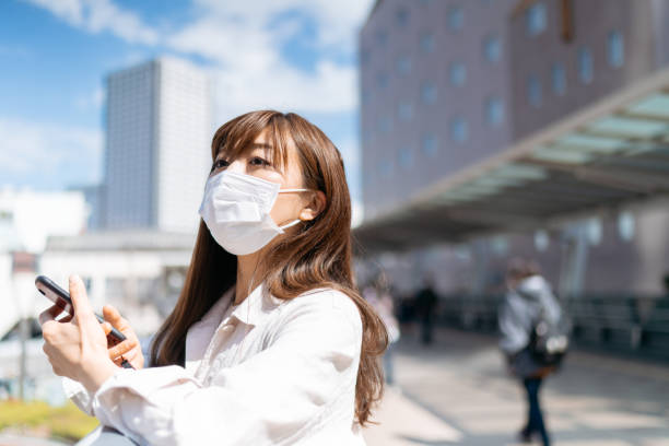 istock Businesswoman wearing protective surgical mask 1212977644