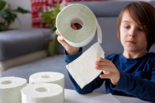 istock Child, playing with toilet paper 1212978496