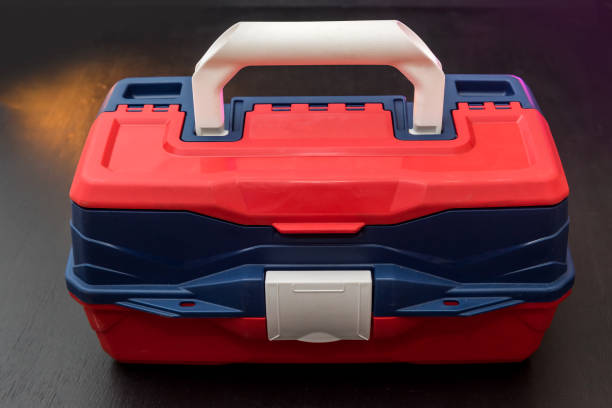 istock Plastic suitcase box with tool lock    isolated on dark background. industry 1212978841