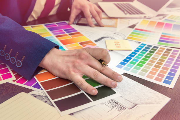 istock Home designer work at office house sketch with color catalog for dream modern renovation apartment. Archtecture house plan and color sample 1212980290