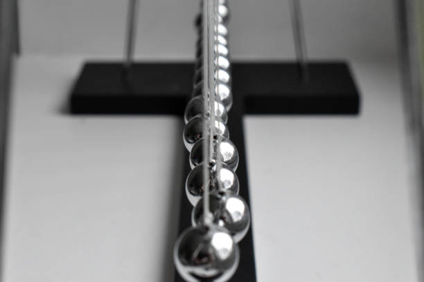 istock Business concept for strategy team work and alignment. Newtons Cradle Pendulum. 1212980646
