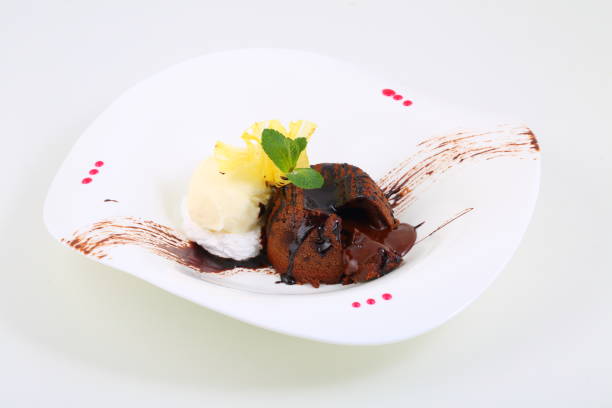 istock Chocolate flan with vanilla ice cream on a white plate 1212982308