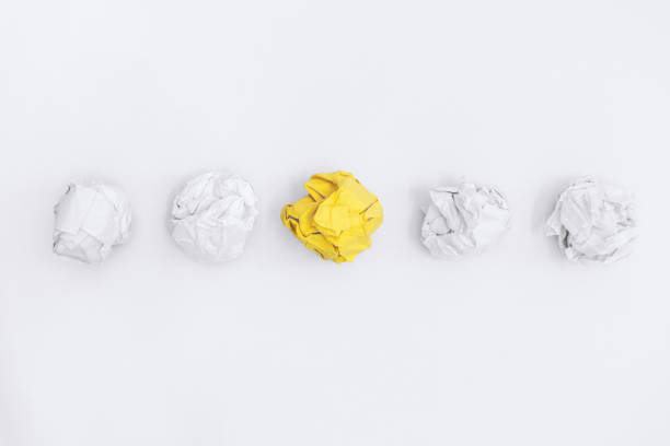 istock Unique Yellow Crumple Paper In Line With Others. 1212984522