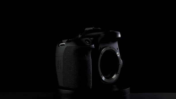 istock No brand camera on black background. Camera matrix is visible, stand rotation 1212984741