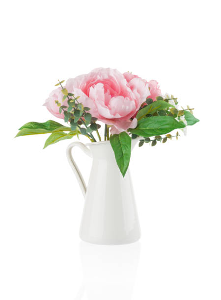 istock Vase with flowers isolated on white background 1212985048
