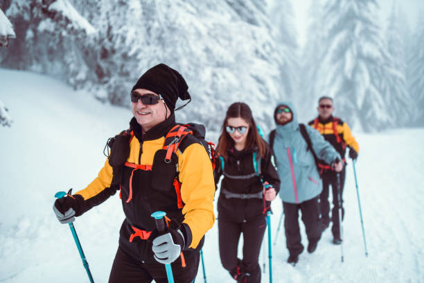 istock Snow Hikers Exploring Snowy Mountain 1212986360