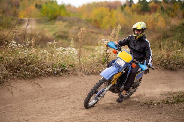 istock Professional rider taking a turn on a dirt road 1212986702