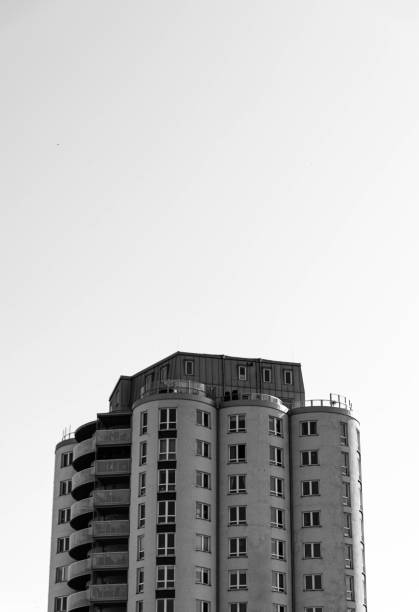 Swedish silo-like residential building exterior at midday in black and white