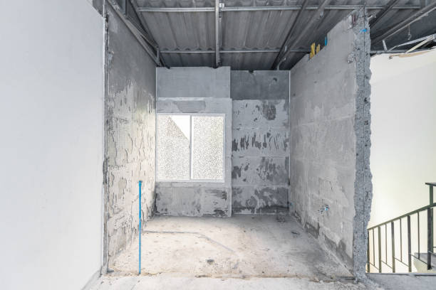 istock Construction site of empty Interior space, unfinished building after demolition process. Home improvement and renovation business. 1212991065