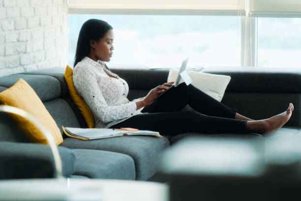 istock Black Woman Working From Home With Laptop Computer 1212991183