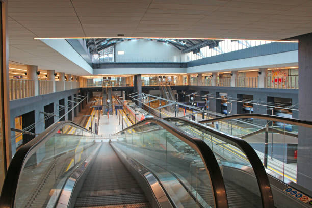 istock Escalator at train station. Empty escalator at railway station 1212994934